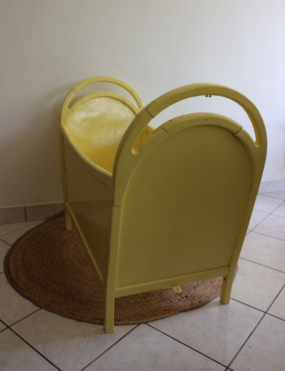 Yellow vintage baby cot