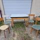 Vintage Scandinavian table and chair set with a wooden frame and formica top.