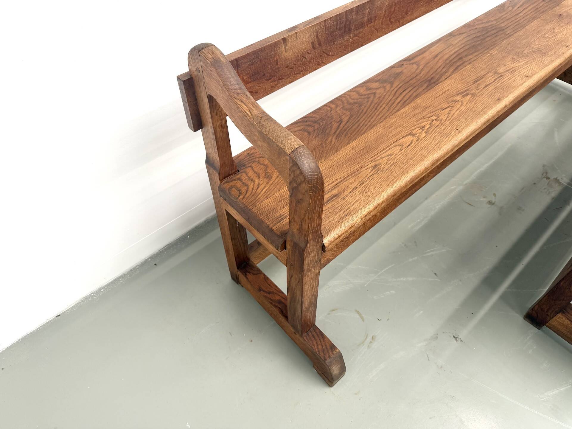 Pair of communal benches in solid oak, 1950s.