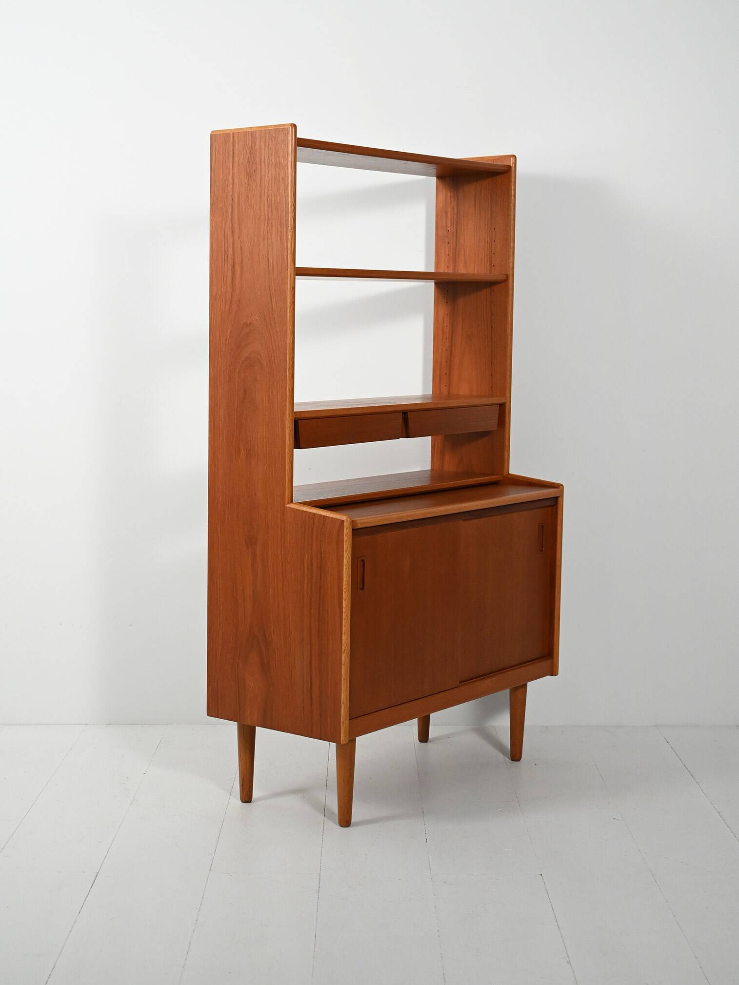 Scandinavian teak bookcase with suspended drawers