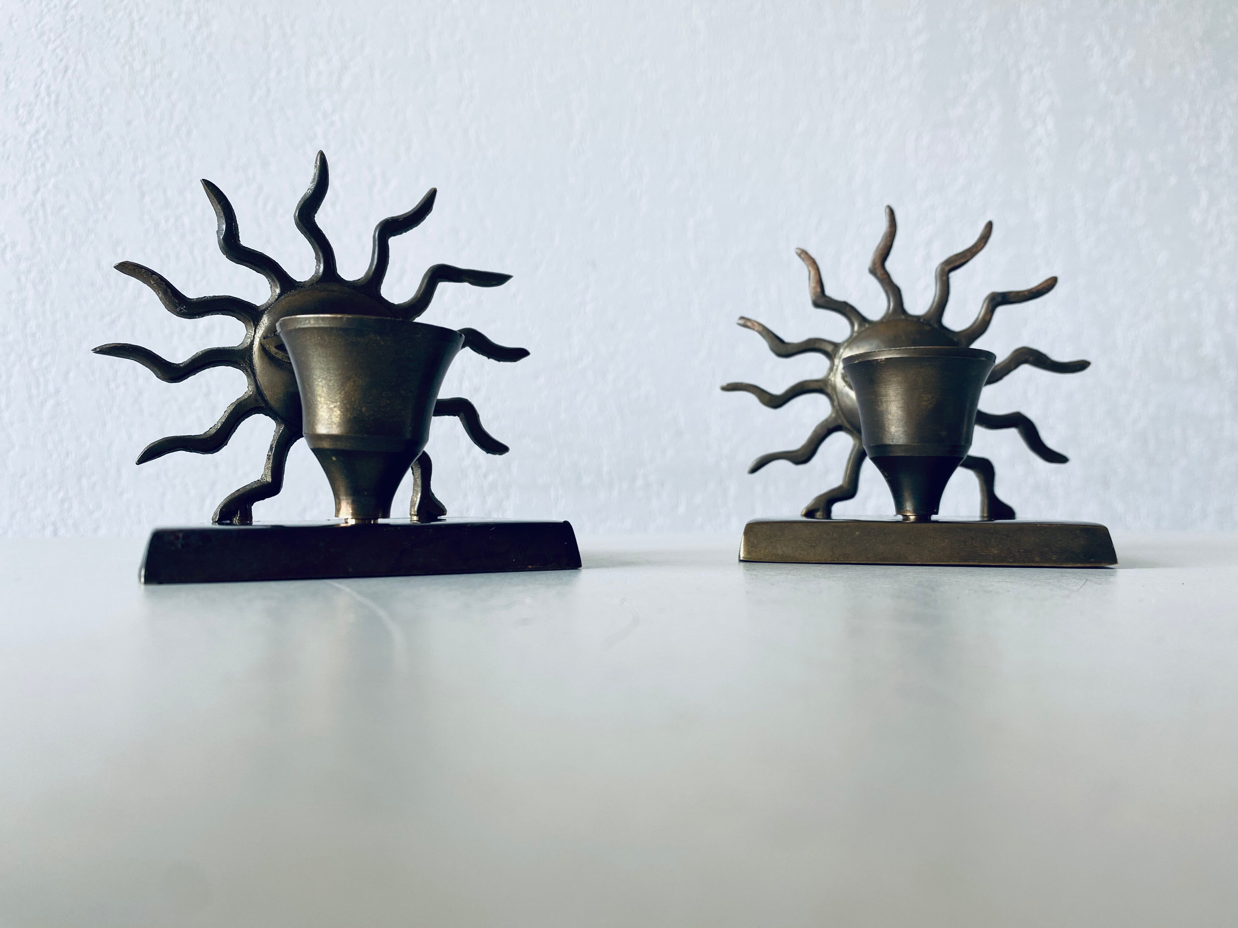 Pair of sun candle holders