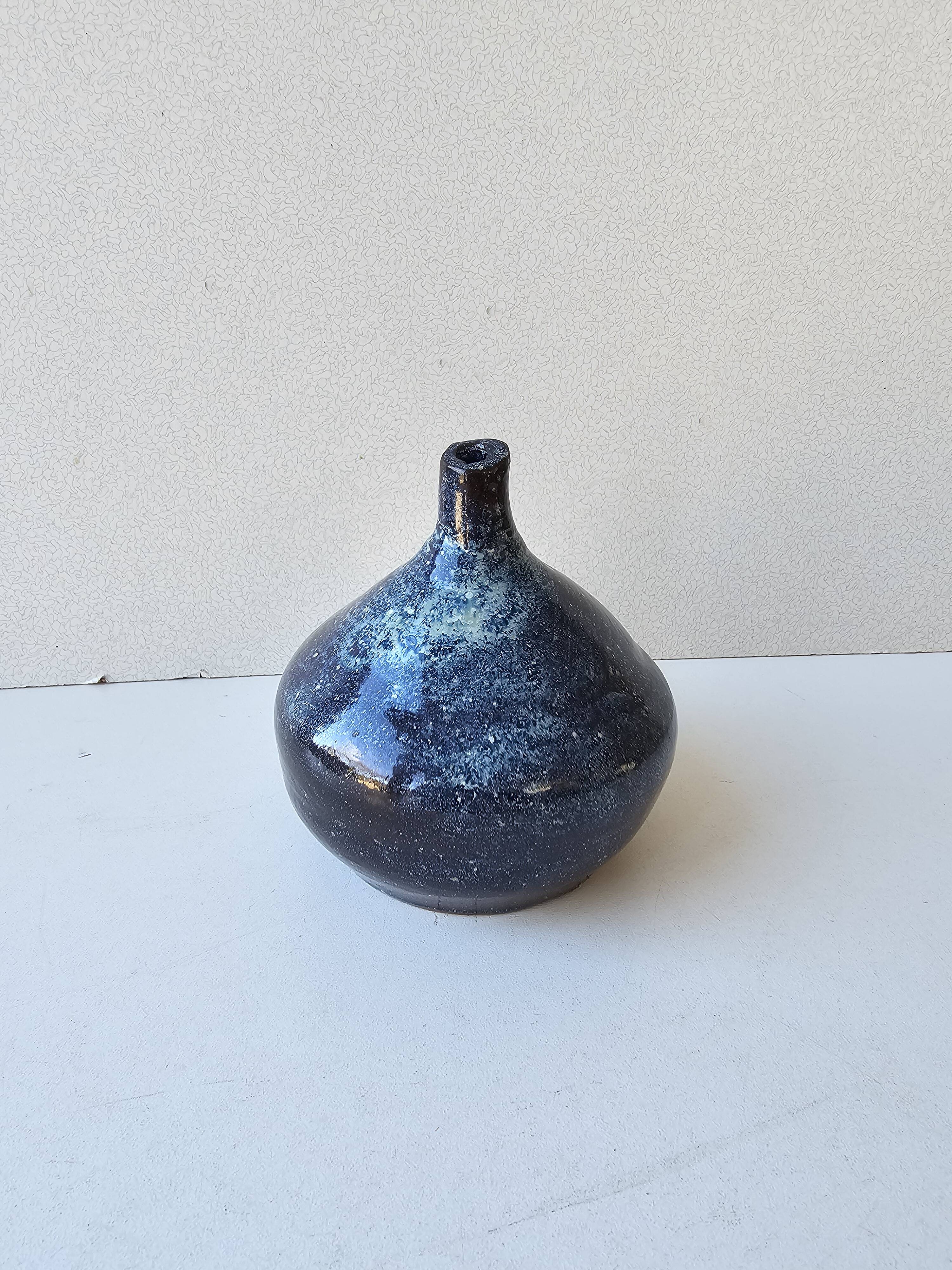Small blue soliflore vase in glazed ceramic signed X (to be identified)