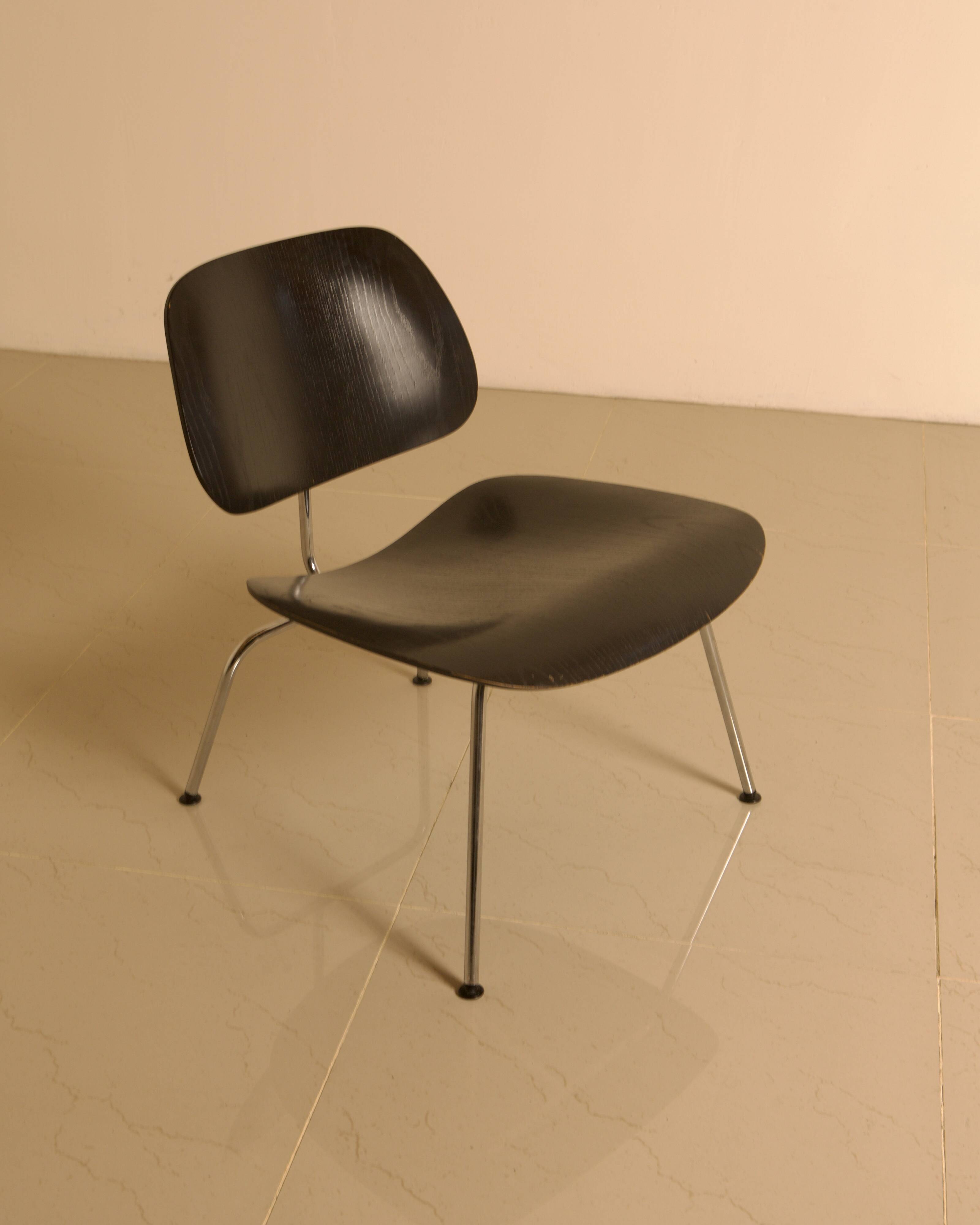 "LCM" chairs in black ash by Charles and Ray Eames for Herman Miller 60s.