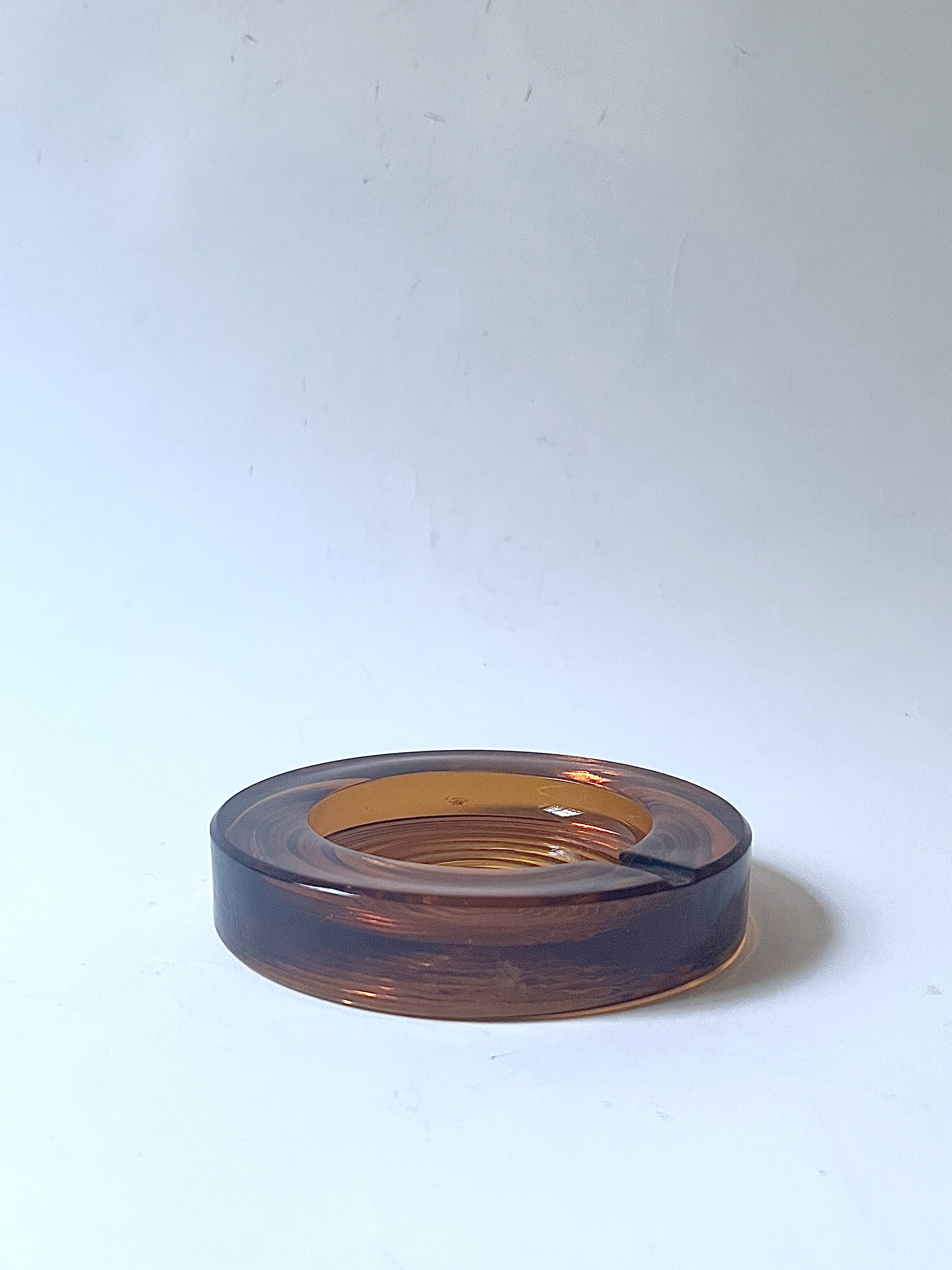 Amber pressed glass ashtray, 1970s design.