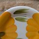 Round serving dish with hand-painted yellow flowers in ceramic TC Italy.