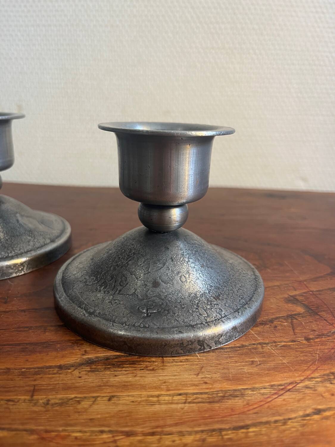 2 Charles Piguet wrought iron candlesticks