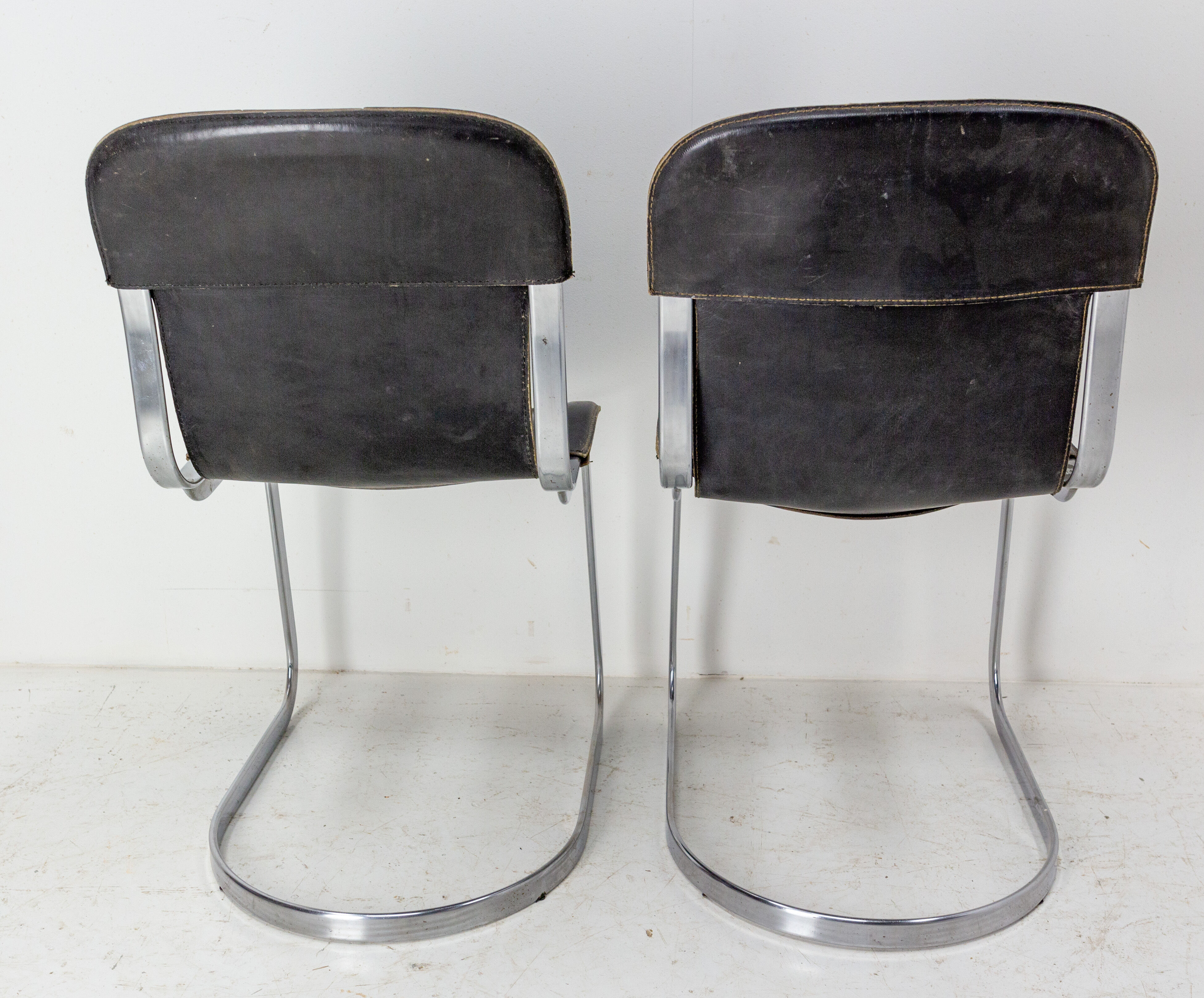 Pair of windmill leather chairs