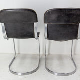Pair of windmill leather chairs
