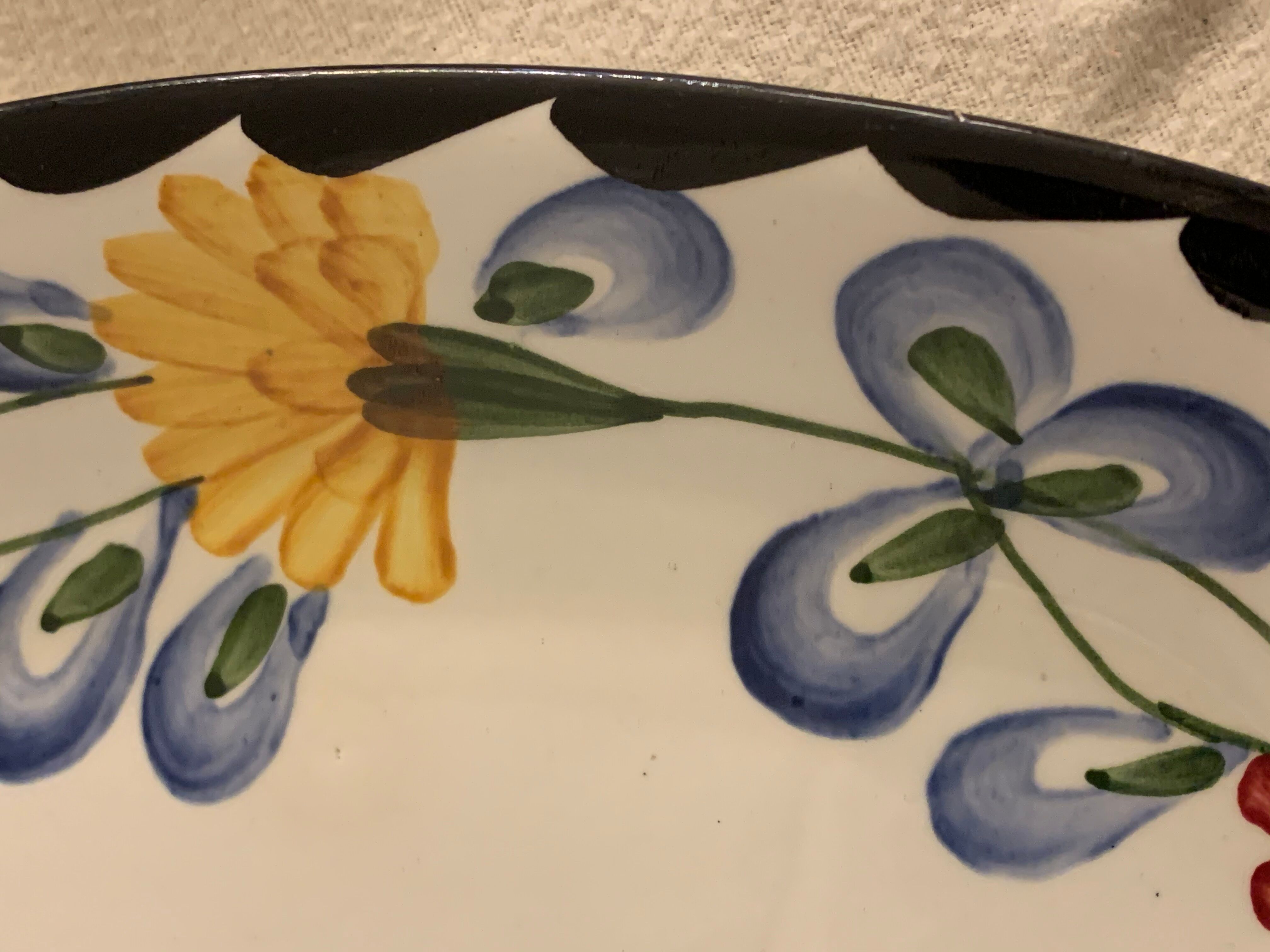 Pair of floral ravines in ancient earthenware Onnaing and CM Paris model Clovers