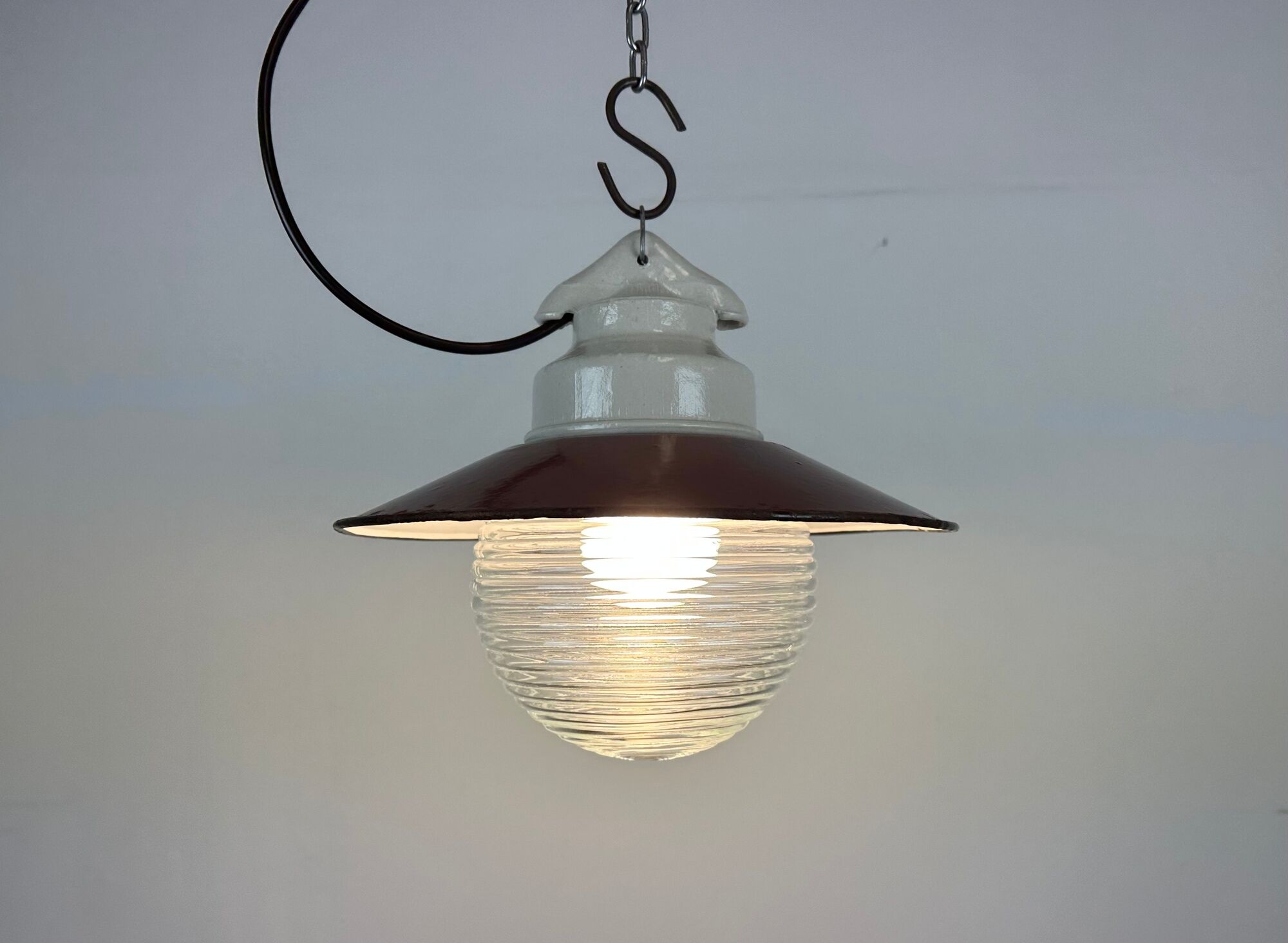 Industrial porcelain red enamel pendant light with ribbed clear glass, 1970s