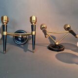 Pair of two-light torchiere wall lights in black lacquered metal and gilded brass, Circa 1960.