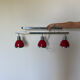 Designer pendant light with 3 red and chrome spots