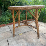 Round table with 2 rattan chairs