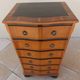 Louis XVI style chest of drawers in wood and cherry veneer.