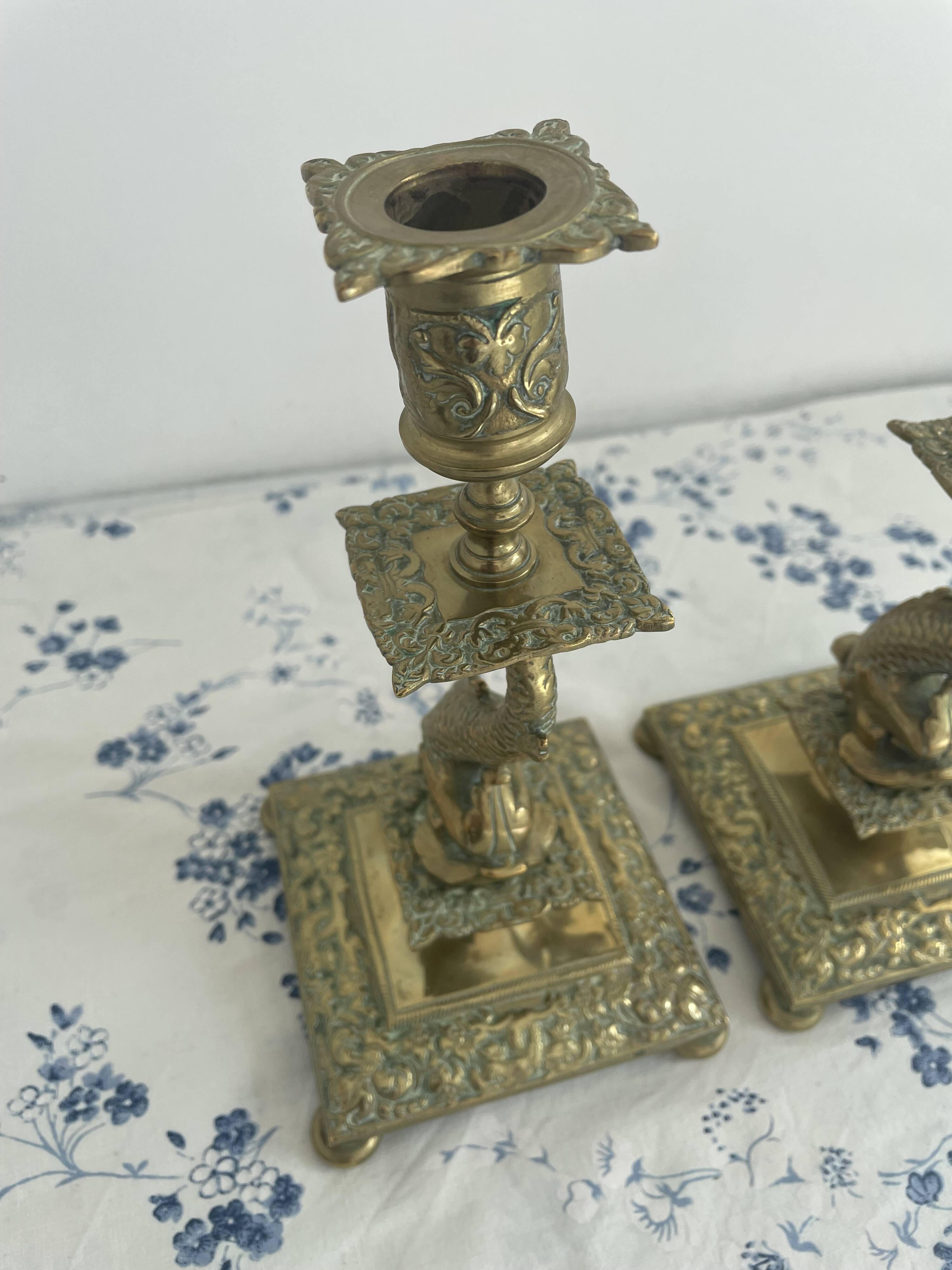 Pair of brass dolphin candlesticks, late 19th century, Napoleonic period
