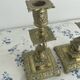 Pair of brass dolphin candlesticks, late 19th century, Napoleonic period