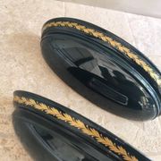 Set of two vintage wall sconces in pine green and gold.