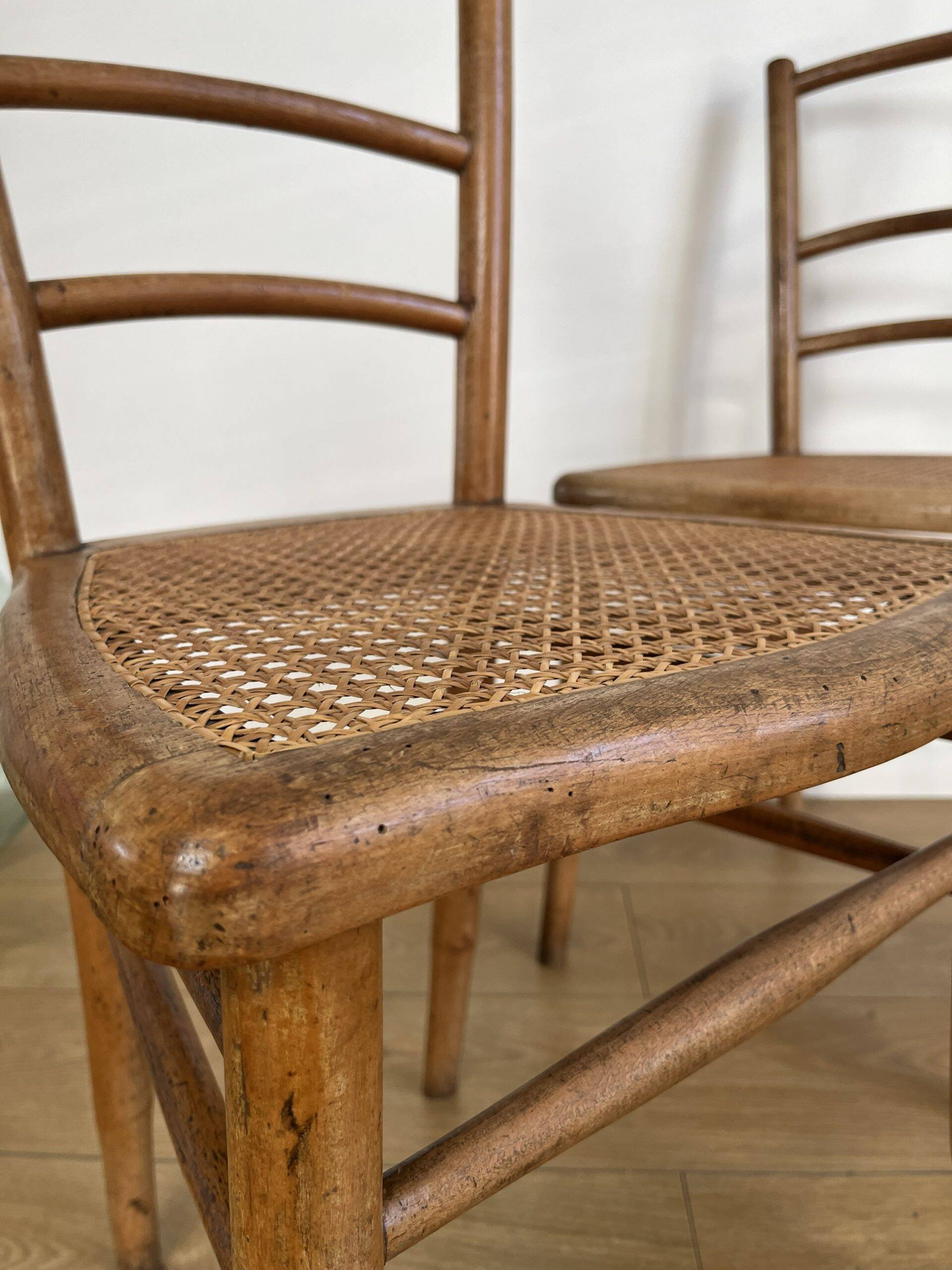 Pair of caned bistro chairs