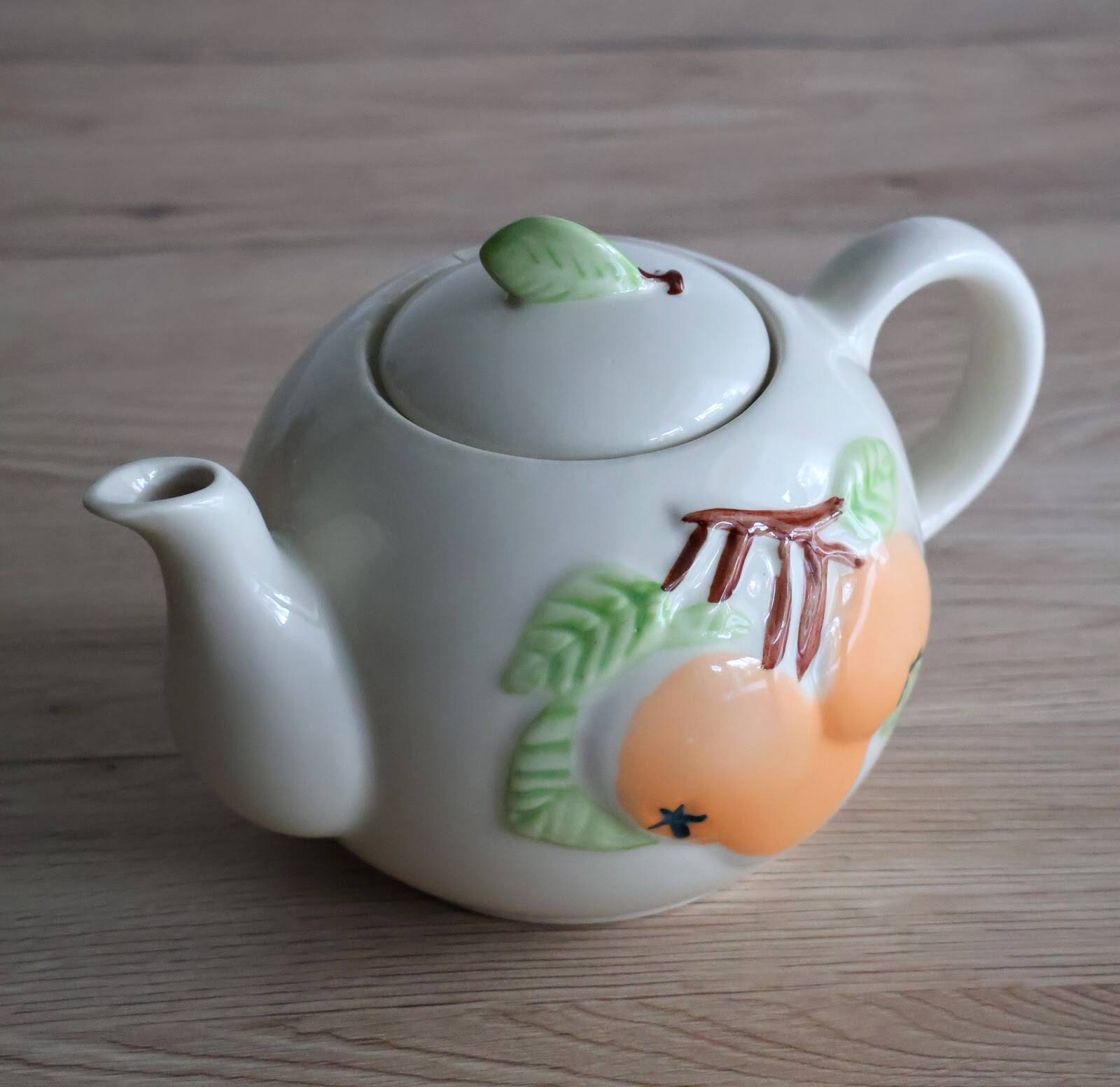 Slush teapot with embossed fruit decoration