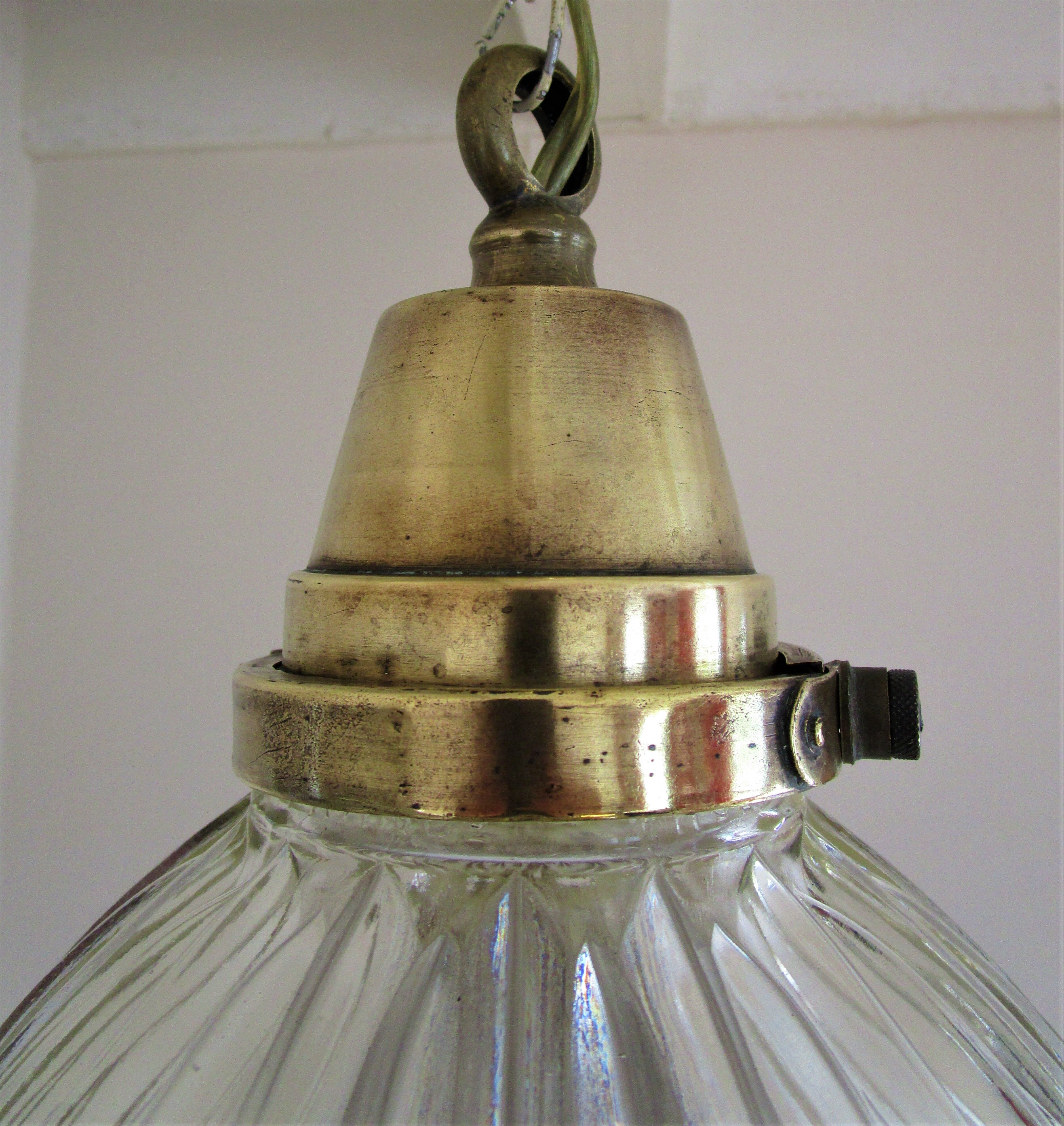 Holophane glass suspension and vintage patinated brass