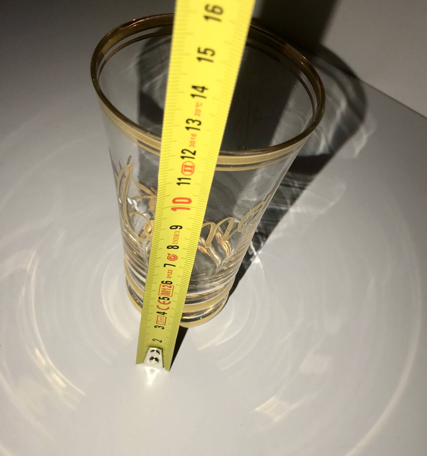 Antique gilded glass with the inscription Maman