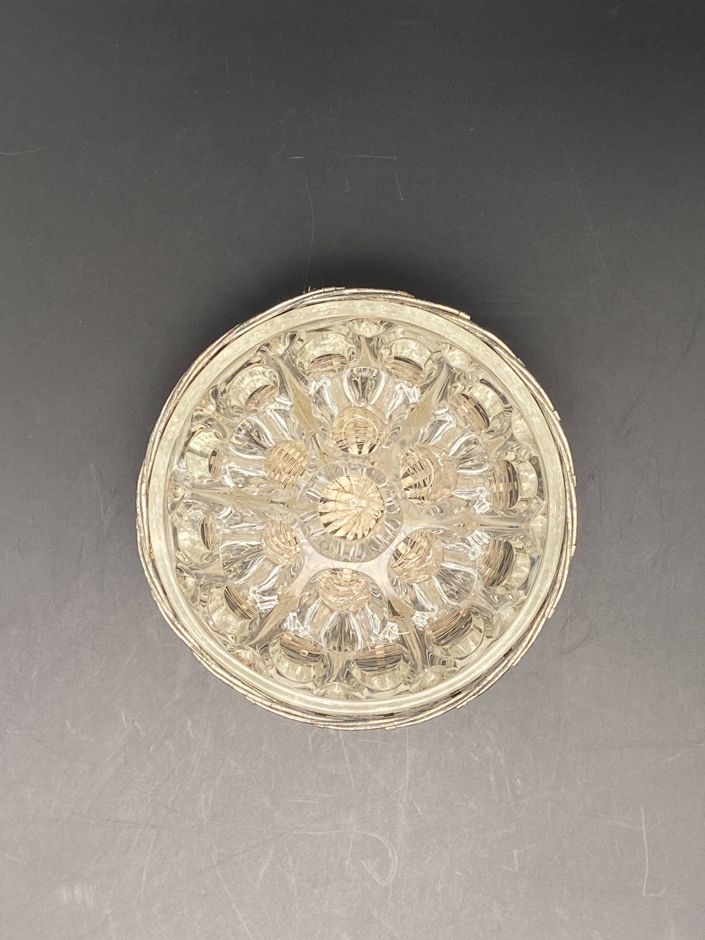 Glass flower stand with woven metal support