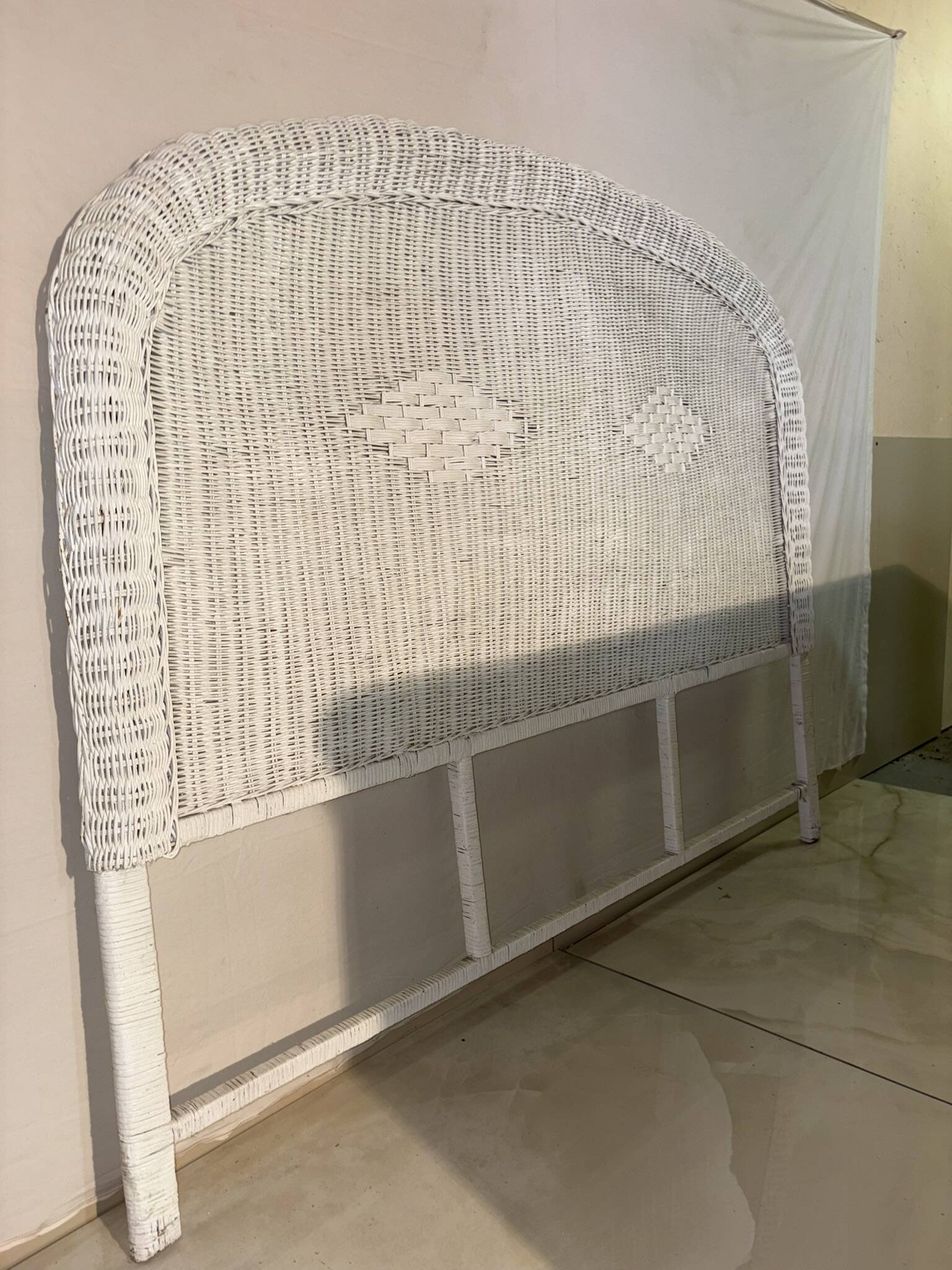 Vintage headboard in woven white rattan