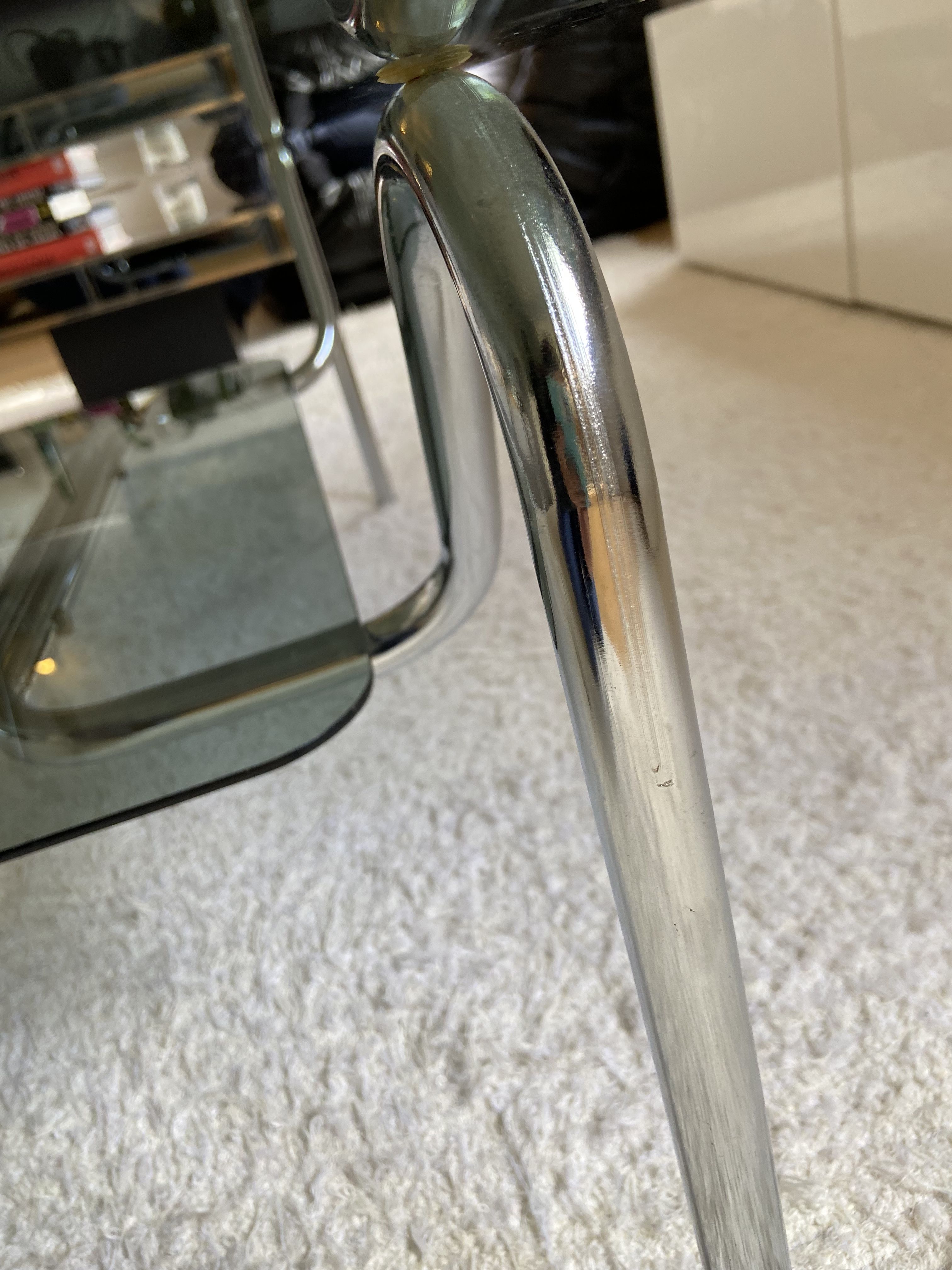 Double top coffee table in smoked glass and tubular structure in chromed steel
