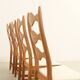 Four oak dining chairs by Henning Kjaernulf.