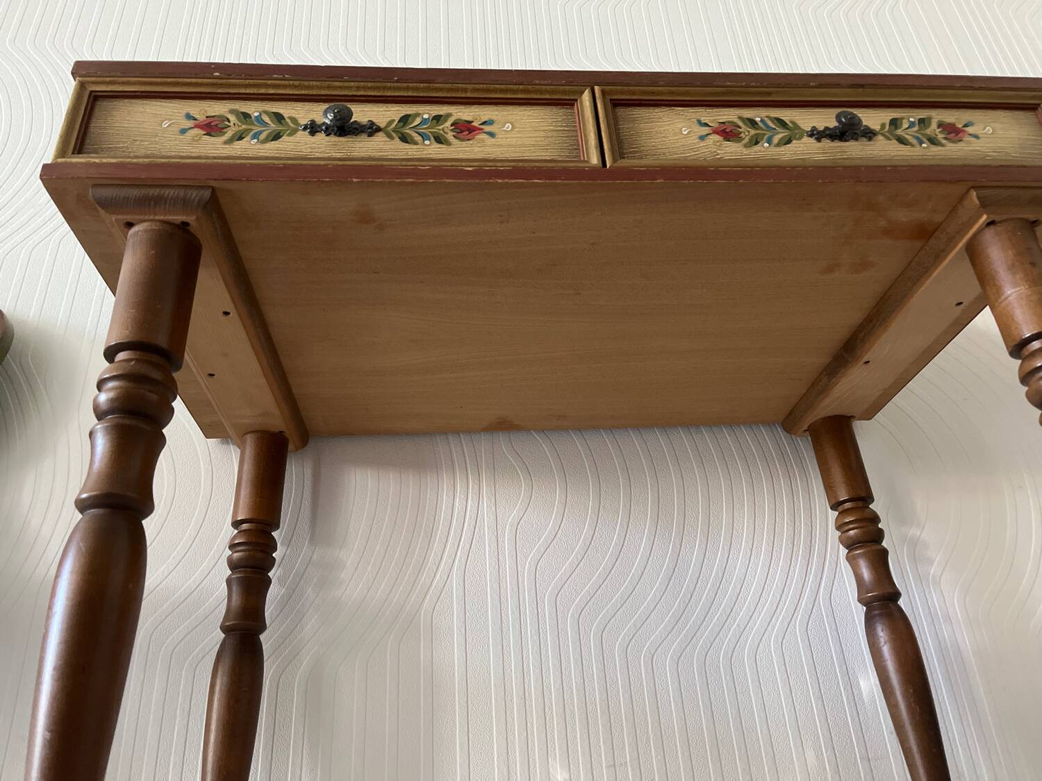 Wooden dressing table with olive green chair and floral patterns
