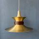 Large UFO flying saucer pendant light with orange light.