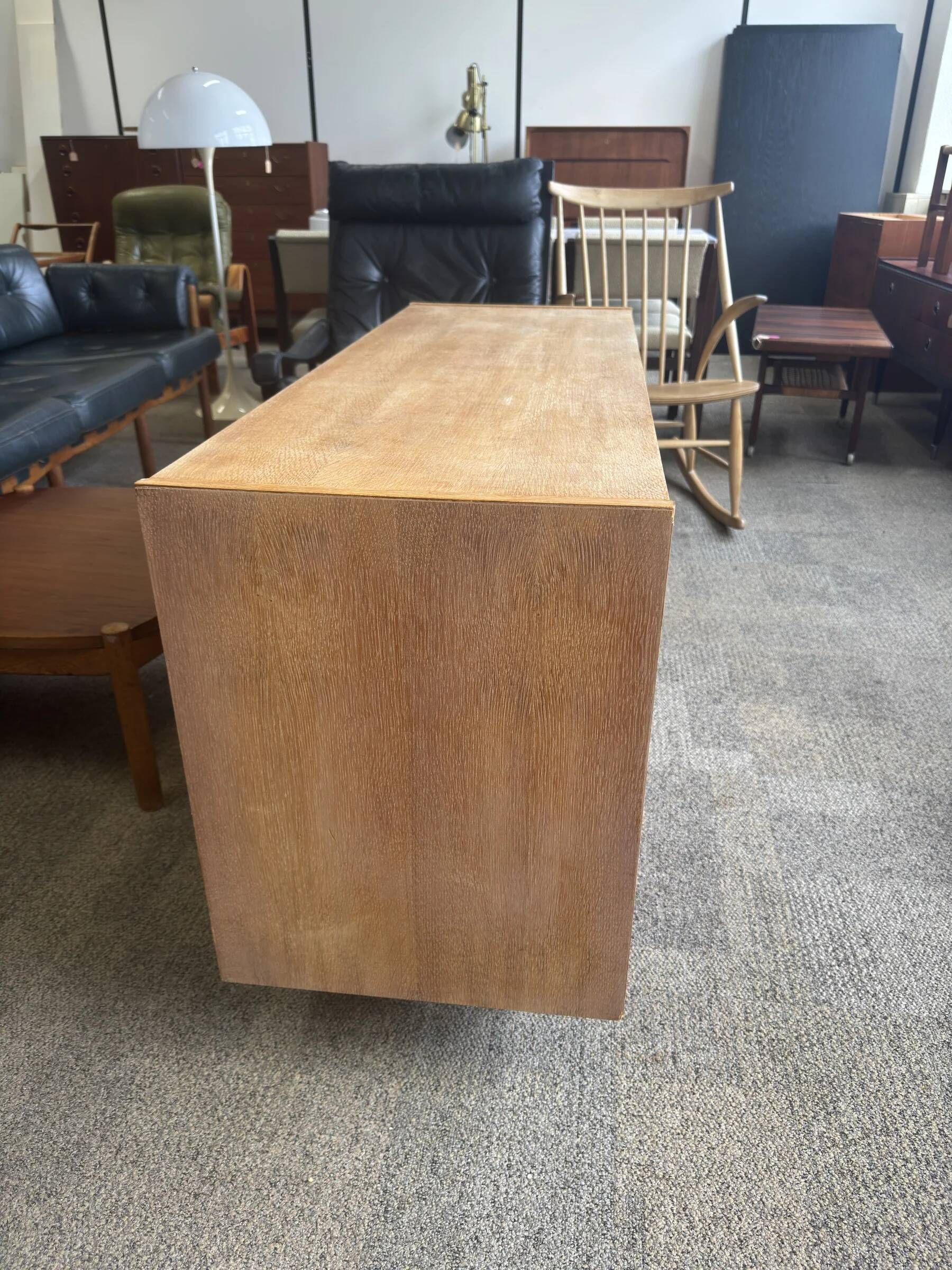 Danish buffet in light oak with sliding door and four drawers.