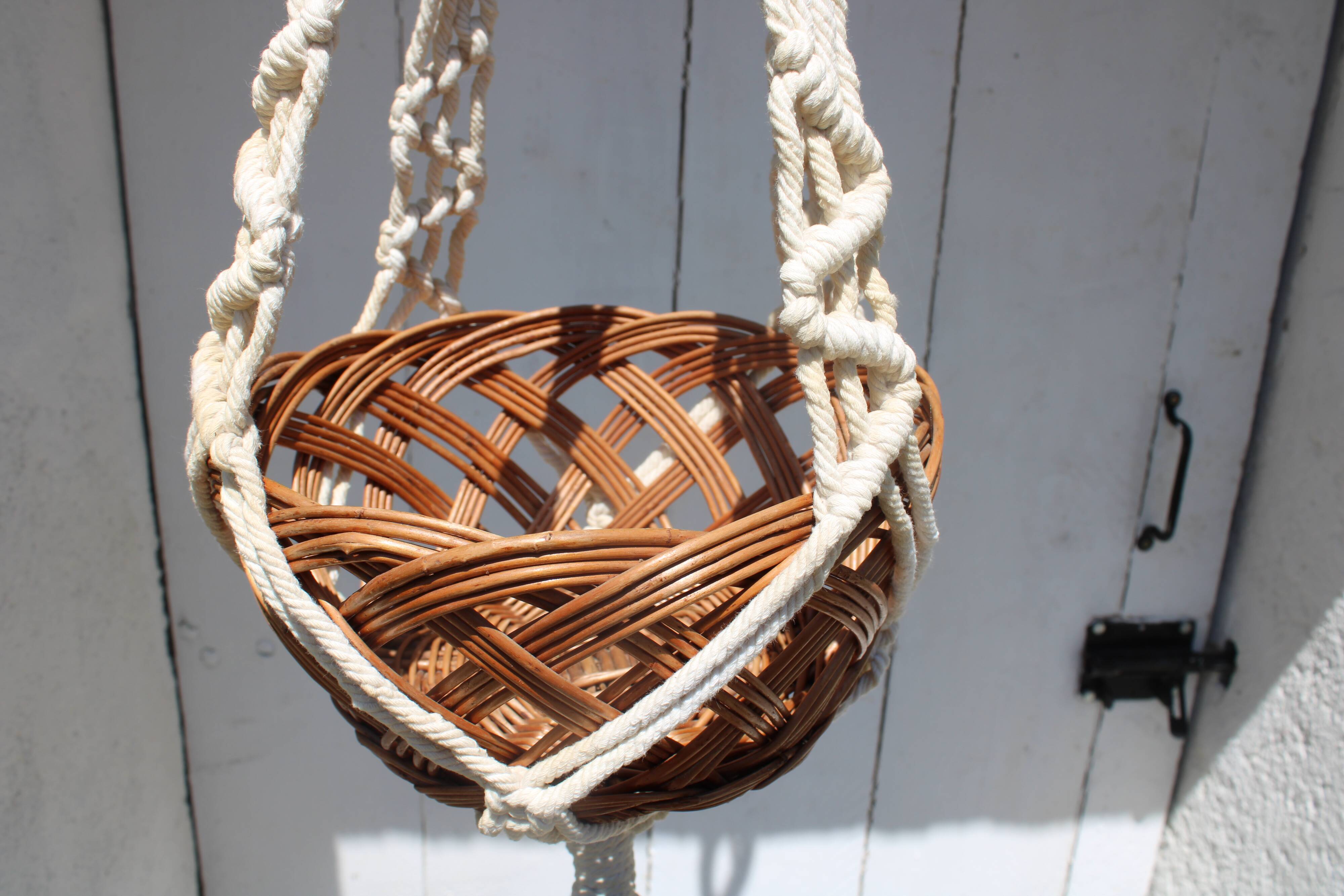 Hanging plant holders in macramé and rattan