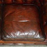 Pair of restored antique Chesterfield sofas in Boudreaux leather.