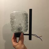 Black metal and molded glass wall sconce