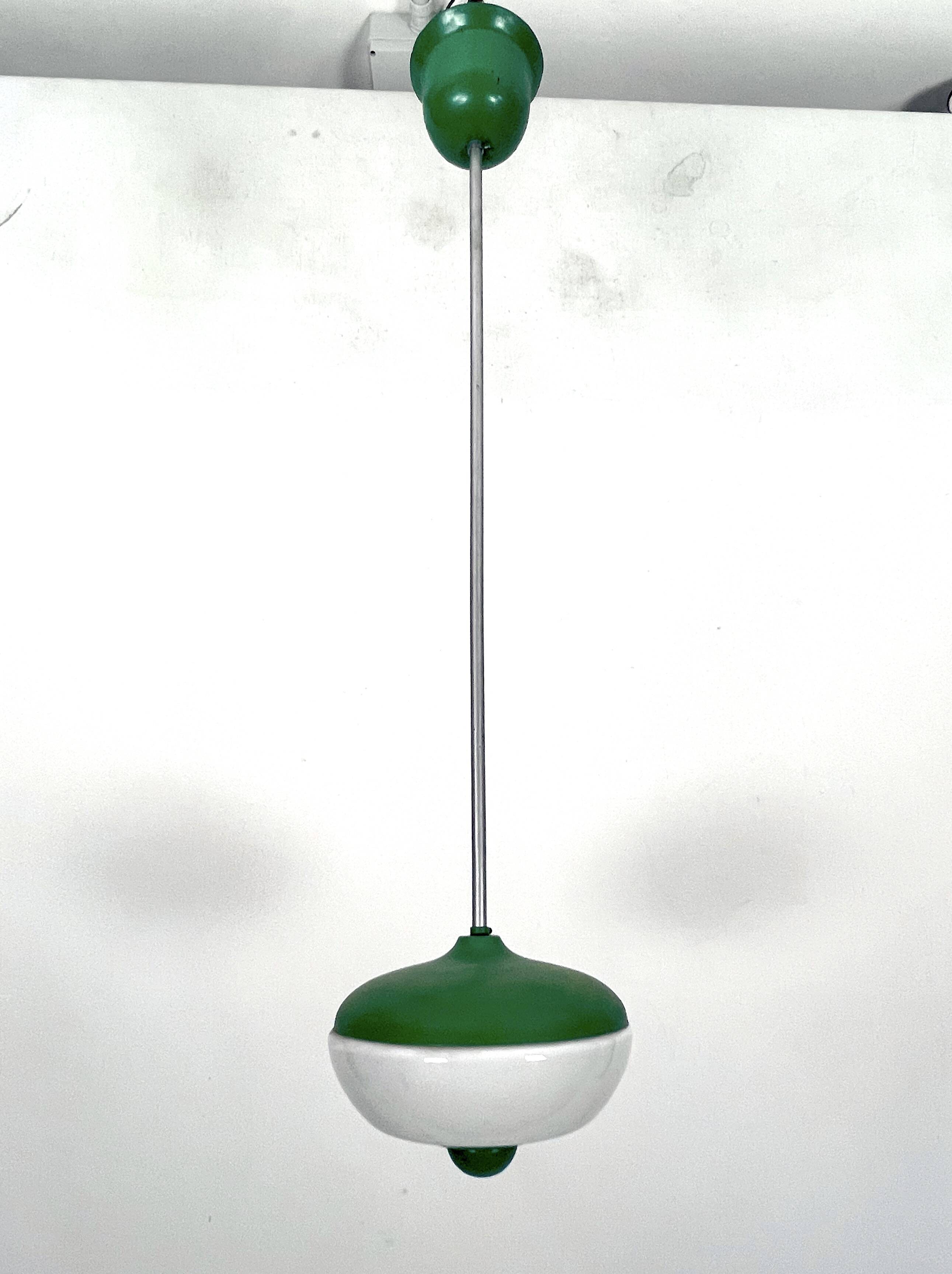 Mid-Century green lacquer and milk glass pendant. Italy 1950s
