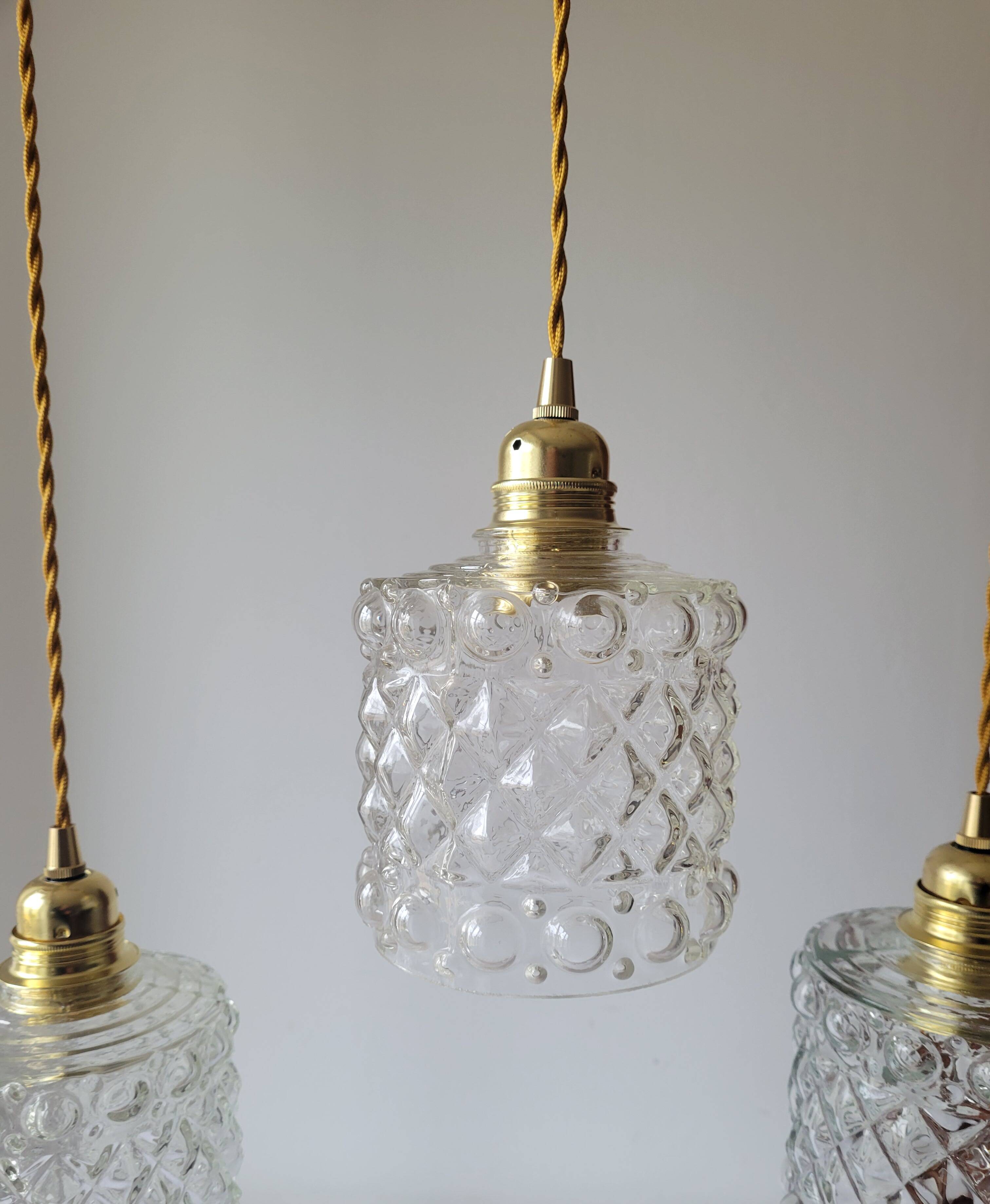 Trio of molded glass pendant lights