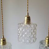 Trio of molded glass pendant lights