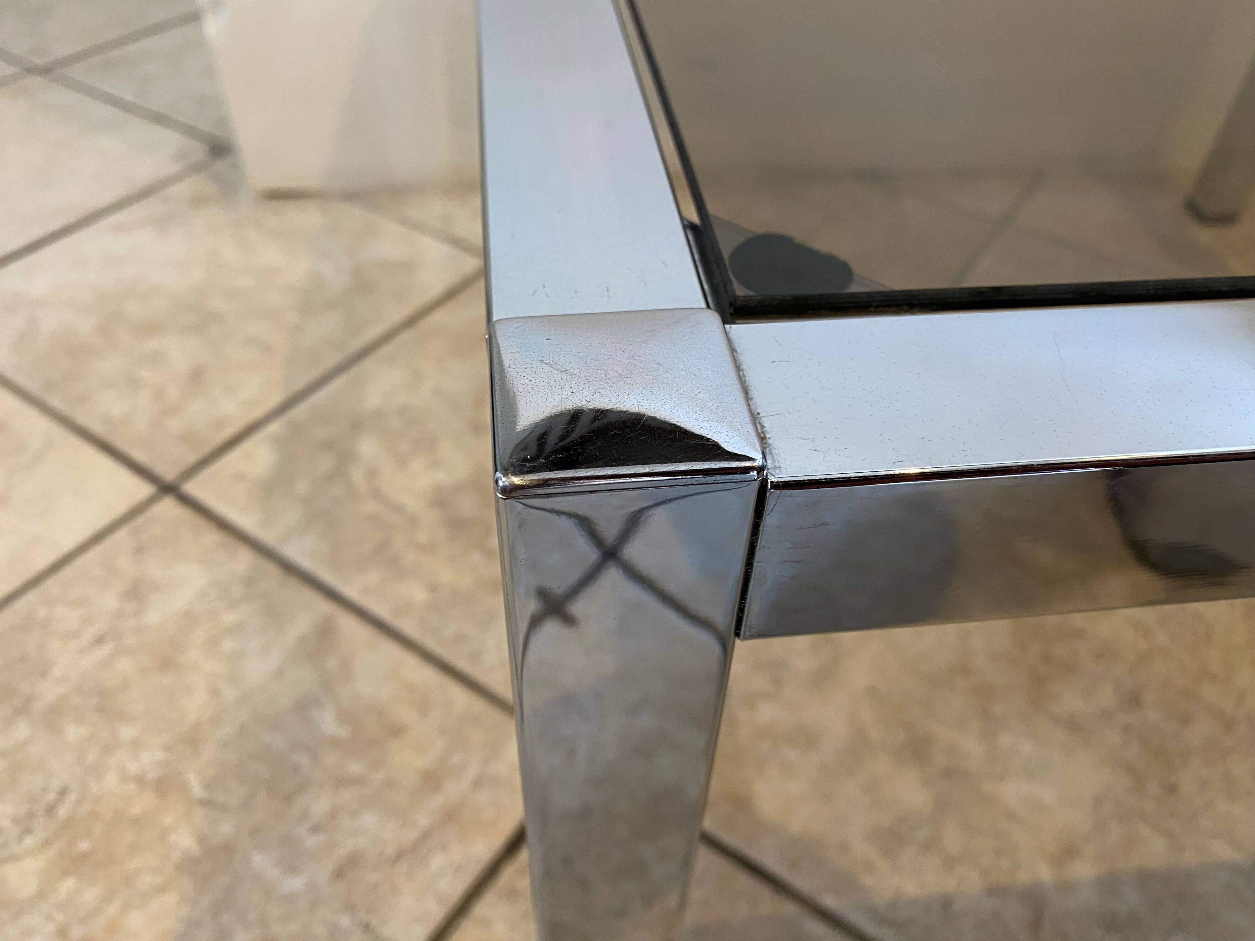 Square coffee table with smoked glass top and chrome base an70
