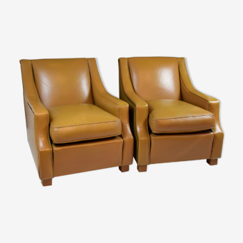 Paire de fauteuils en cuir marron