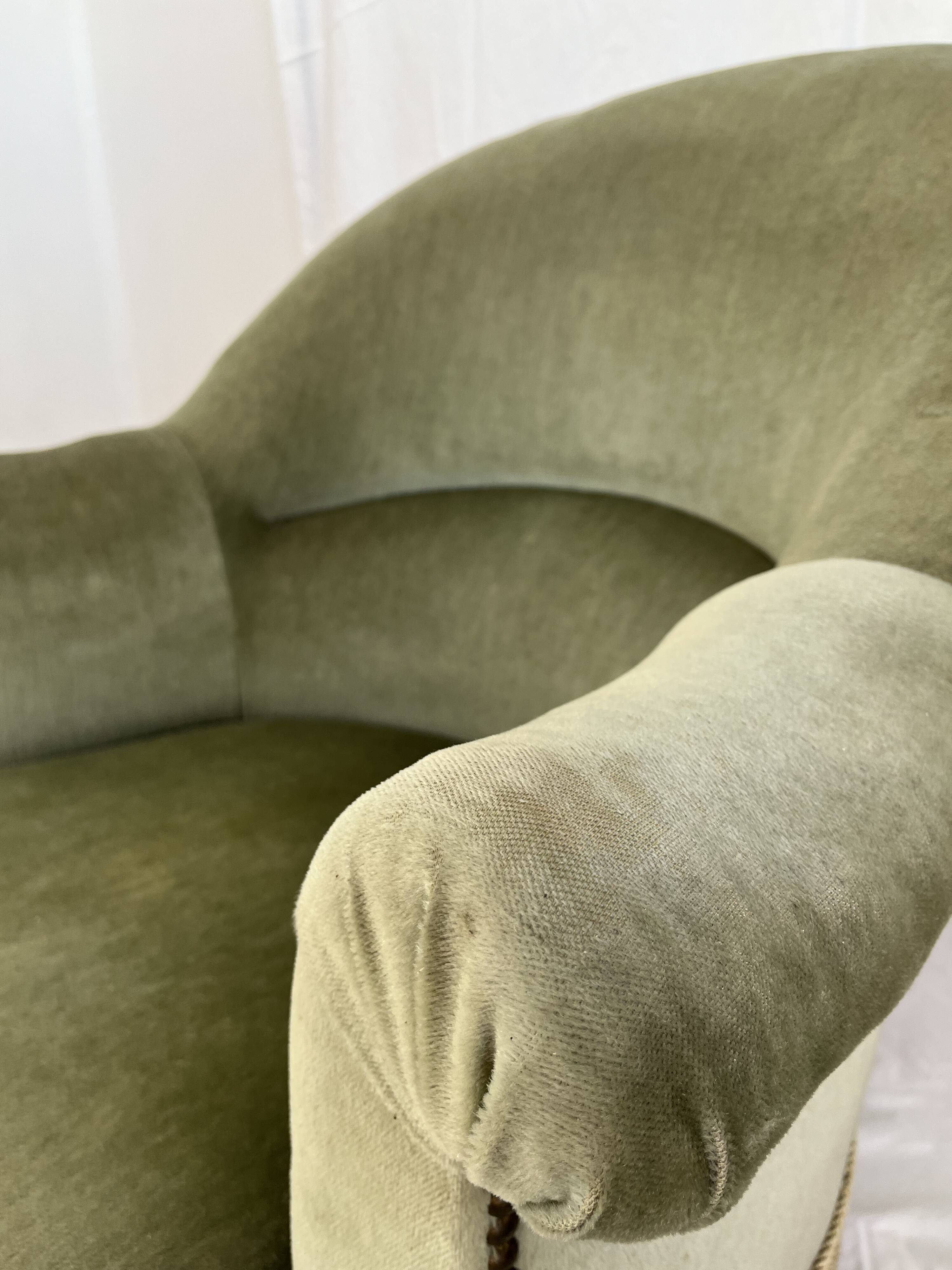 sage green toad armchairs with gold fringe