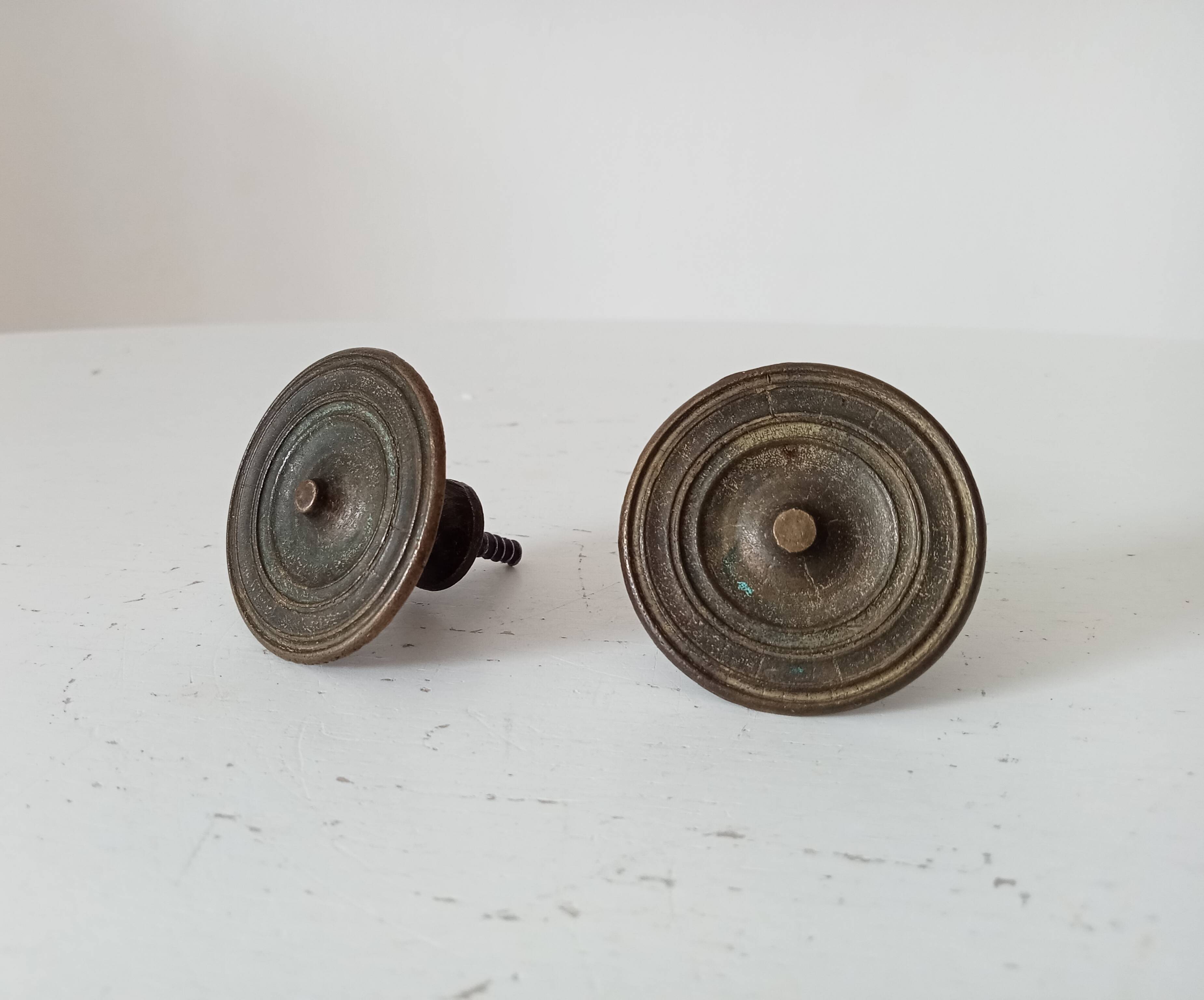 Pair of antique Empire furniture knobs from the 19th century.