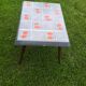 Small 1960s enamelled table, spindle legs, signed jd.