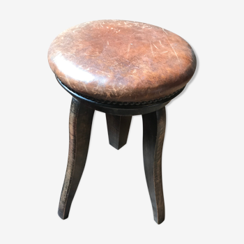 Old leather rotating piano stool