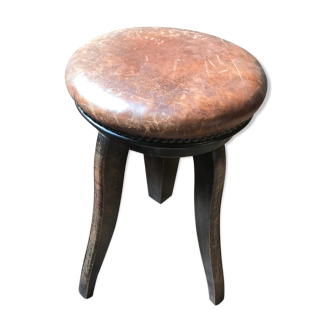 Old leather rotating piano stool