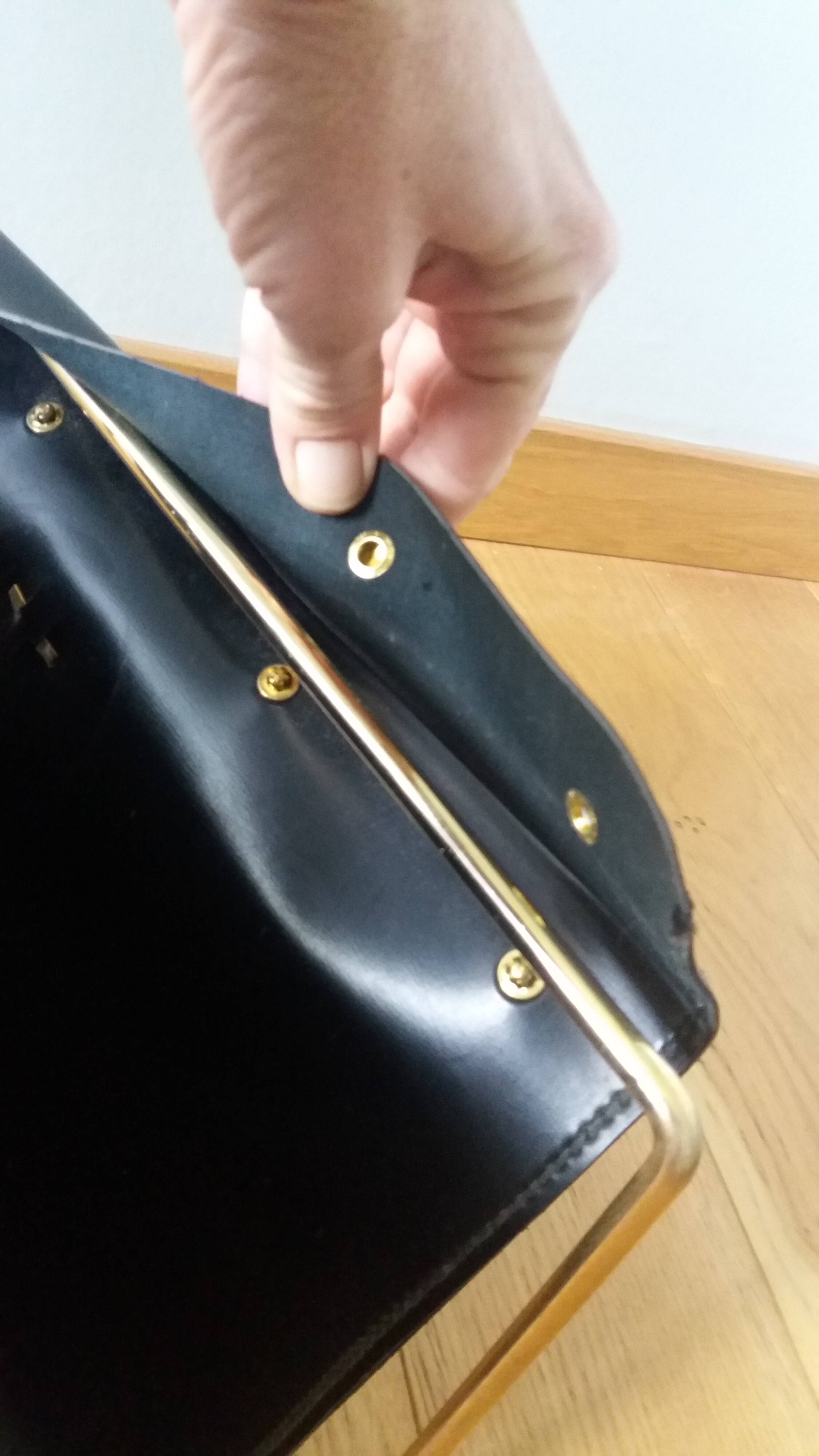 Modernist magazine rack in the style of Jacques Adnet