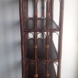 Library shelves in dark rattan