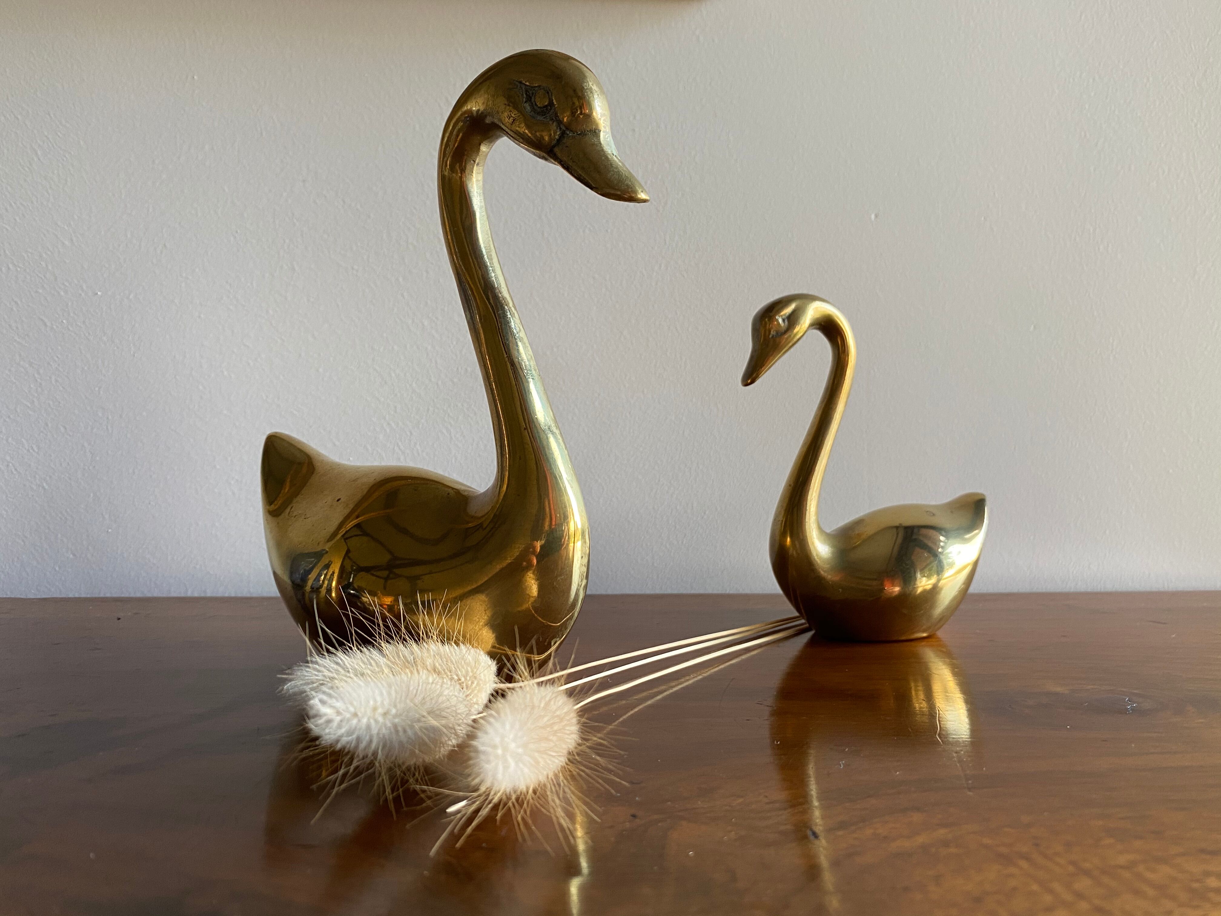 Duo of ancient brass swans