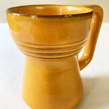2 tasses en céramique émaillée jaune, signées