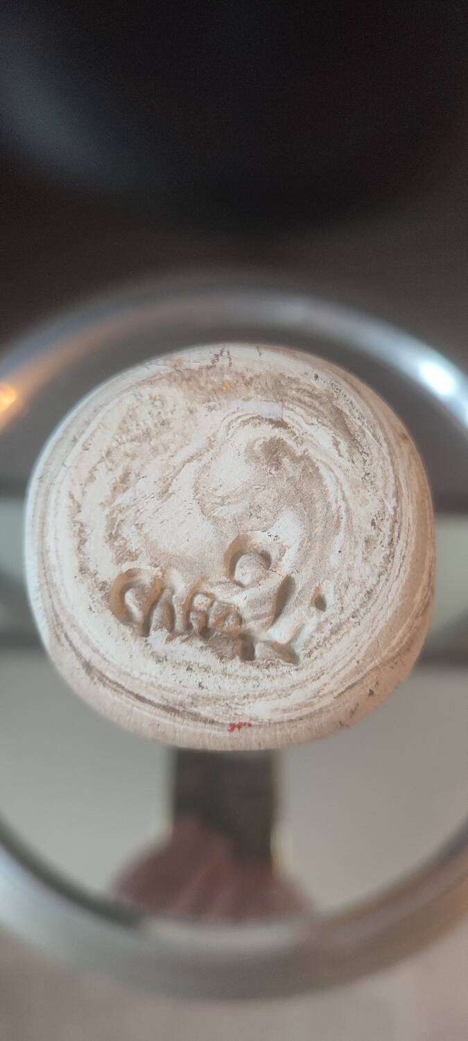 Turned stoneware vase signed with relief decoration.